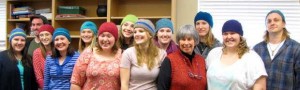 Cathy Wimett knits hats for her students.